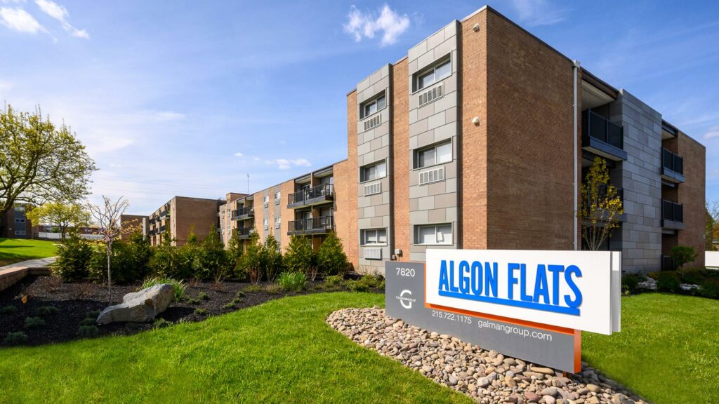 Algon Flats property exterior with sign